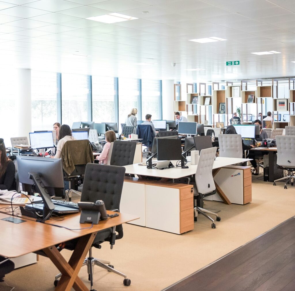 Team collaborating in a modern workspace showcasing office and business network support services for growing businesses.