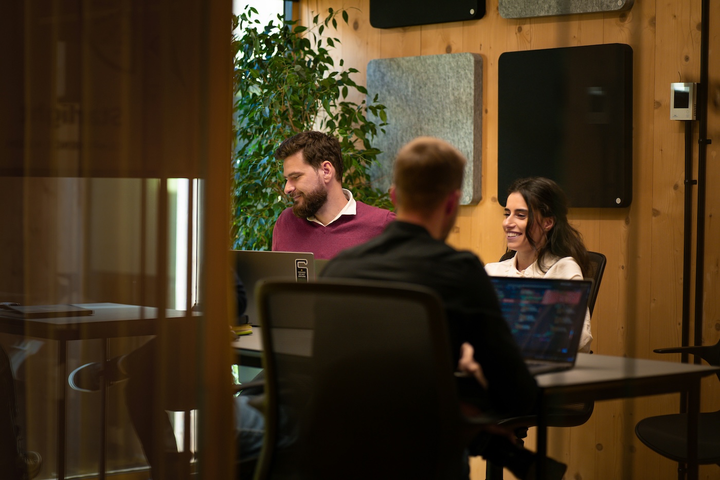 People collaborating in a modern workspace.