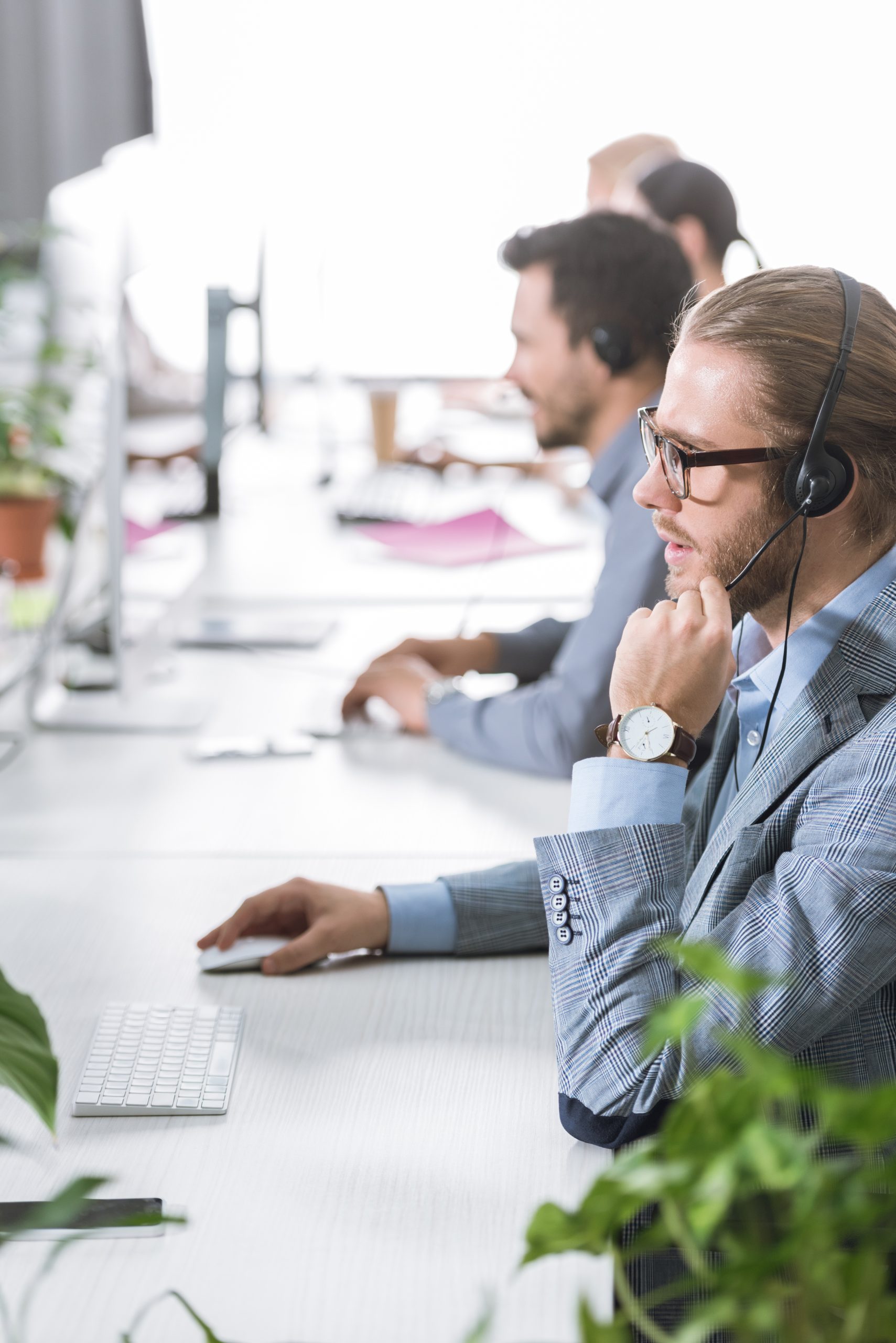 focused image of an Emergency IT Services operator in headset working in office