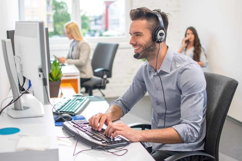 Handsome young male providing managed IT solutions